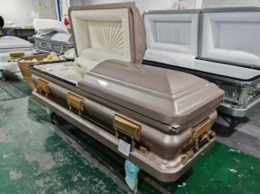 Open silver and champagne casket