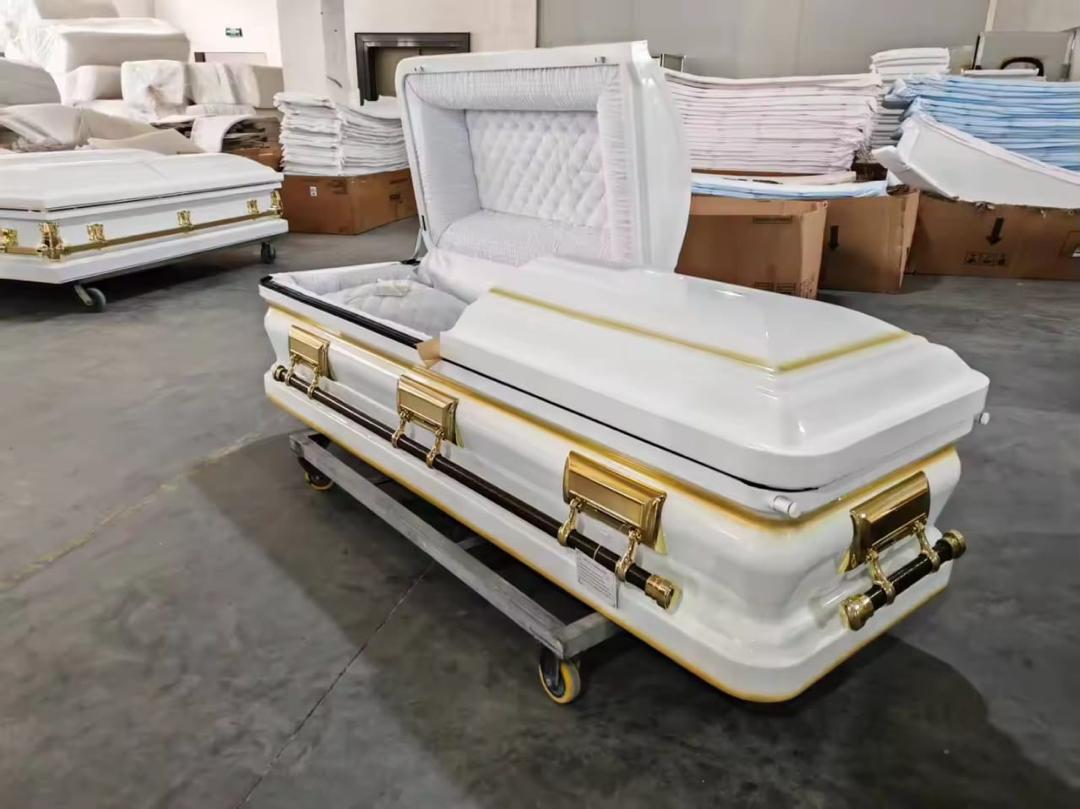 Open white casket with gold details